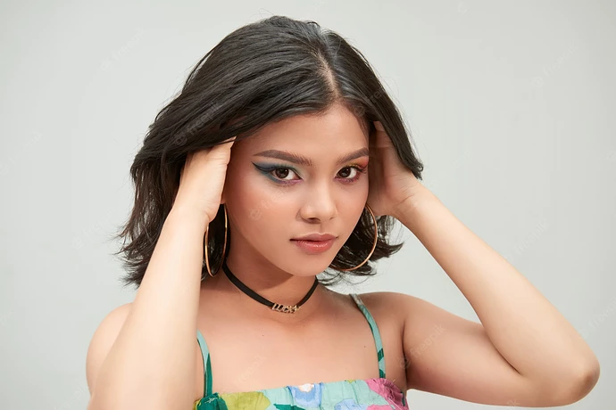 asian-woman-with-curly-beautiful-hair-gray-girl-with-pleasant-smile-short-haircut-bob-hairstyle_264197-949